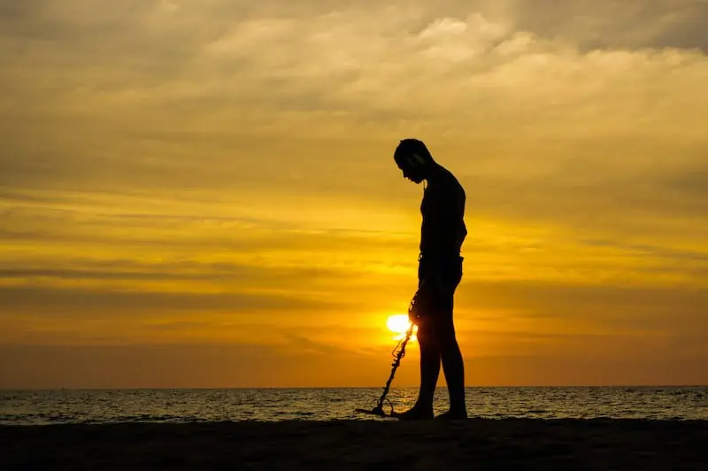 Metal detecting at a beach